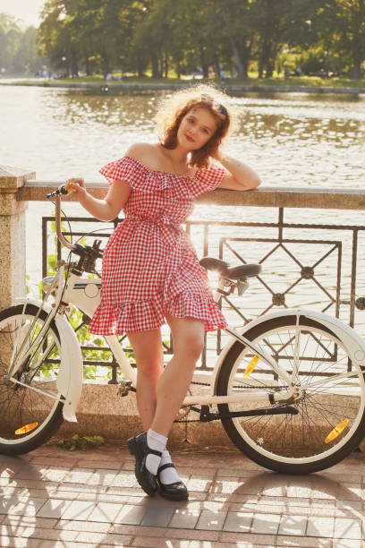 istock pretty girl cyclist 1411269938