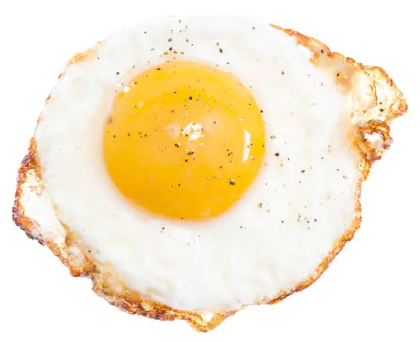 Photo of Sunny side top up egg isolated on plain white background top egg view