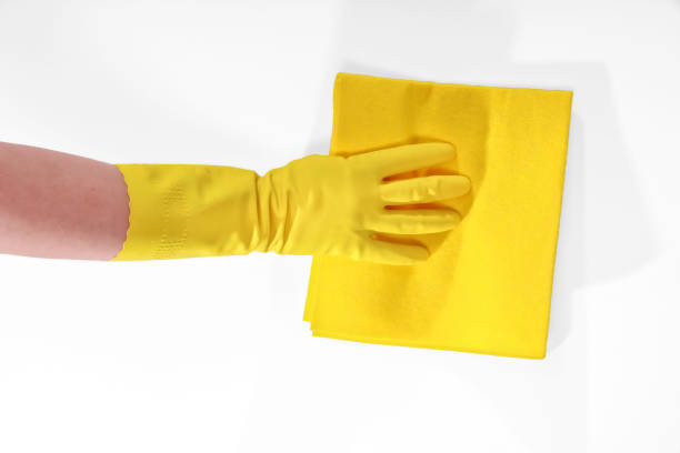 Close up hand with protective yellow gloves