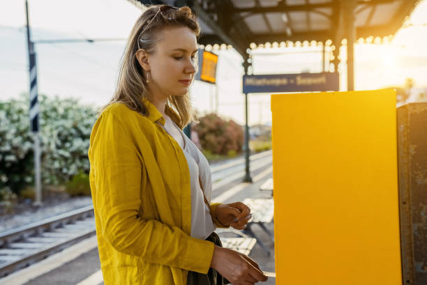 istock Woman validates a train ticket in Italy. 1411274652