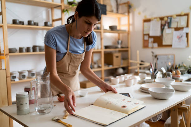 istock Female small business owner working at her pottery studio 1411274670