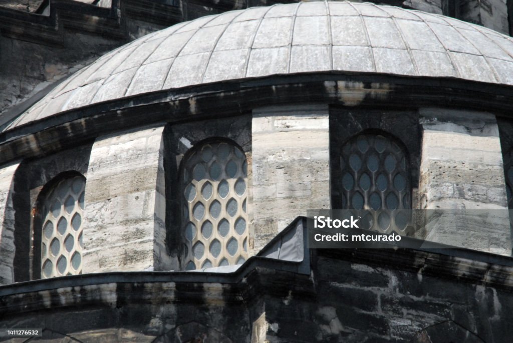 Semi-dome at the Yeni Mosque / Valide Sultan Mosque, Ottoman architecture of Istanbul, Turkey Istanbul, Turkey / Türkiye: New Mosque / Yeni Cami / Valide Sultan Mosque - detail of an half dome on a haunch - located at the south-east end of the Golden Horn, the mosque is part of the historical shopping district, it is attached to the Spice Bazaar - Fatih district. The order for the construction of the Yeni Cami was given in 1597 by Safiye Sultan, the wife of Sultan Murat III. She laid the foundation stone for the construction of the mosque. The mosque was completed in 1663, almost 70 years later, by Sultan Mehmed IV. Mosque Stock Photo