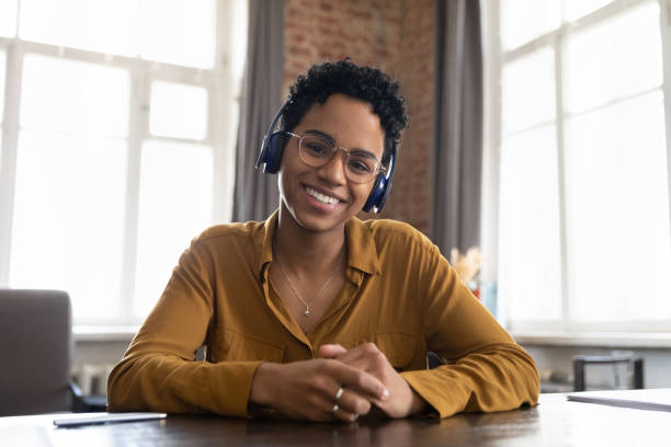 istock African woman looks at camera having virtual meeting through videoconference 1411276764
