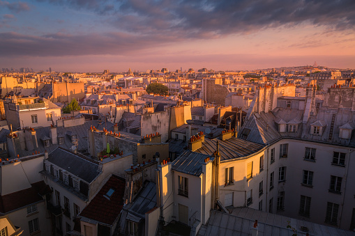 Parisian roofs of Montparnasse and Montmartre at dramatic sunset Paris, France