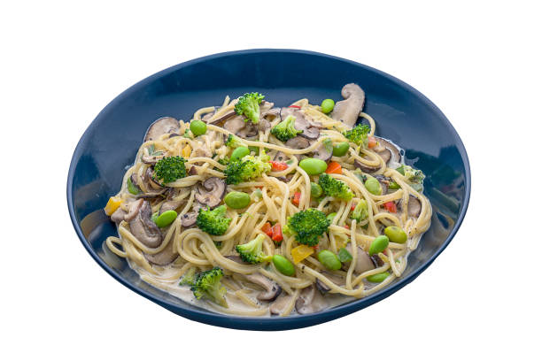 istock Broccoli Bits Cream pasta served in a dish isolated on plain white background side view 1411282386