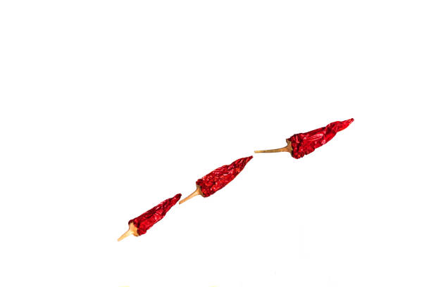 Close Up Group Of Dry Red Hot Chilli Peppers Isolated On White Background, Peppers Levitation, Front View