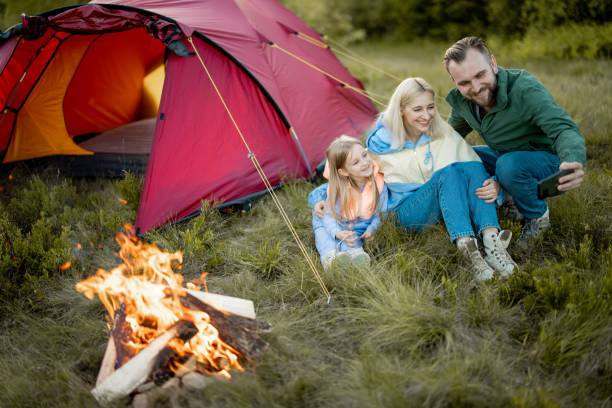 istock Family spend summer time at campsite while travel 1411285036