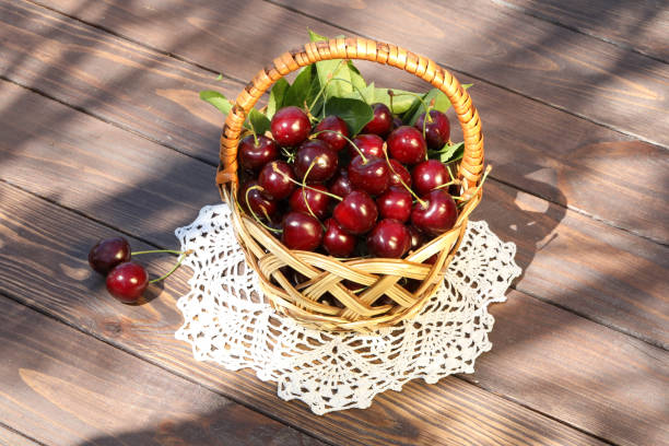 Fresh sweet cherry on wooden background