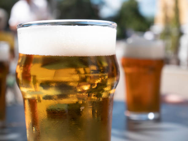 istock small beer, two glasses of beer on the table outside 1411287361