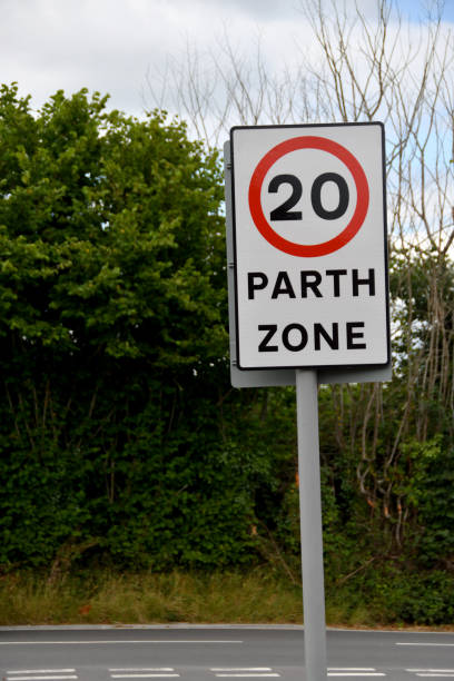 istock Road sign at start of a 20 mph speed limit zone 1411288023