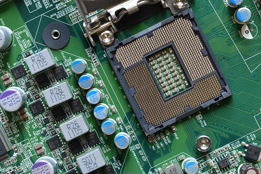 Detail of a CPU Socket on a Motherboard. Printed Circuit Board - Computer Motherboard with Components. Close-up