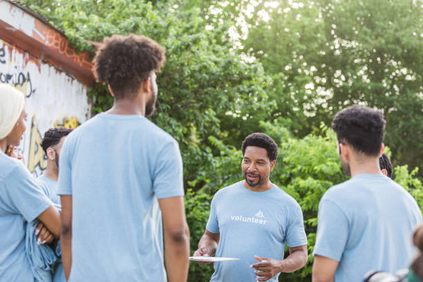 istock Male team leader talks to his group 1411288751