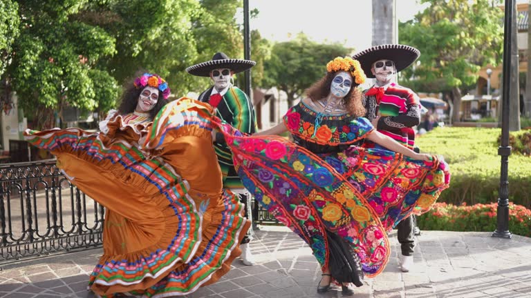 Group of friends dancing and celebrating the day of the dead