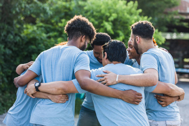 istock Friends participate in a group hug 1411288802