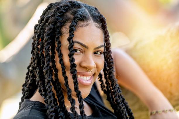 istock Smiling afro-latinx young woman looking at the camera 1411288933