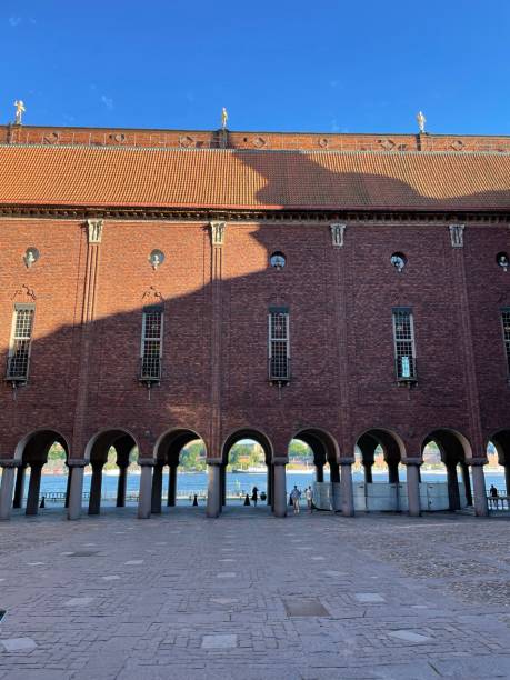 Stockholm waterfront seen through City Hall columns Stockholm City Hall colonnade kungsholmen town hall photos stock pictures, royalty-free photos & images