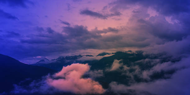 istock Majestic landscape with mountains and clouds at sunset. Atmosphere 1411290011