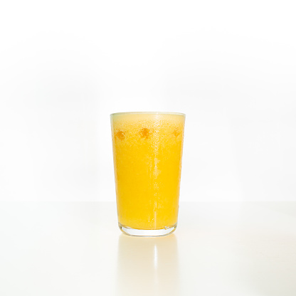 Orange Juice on white\nShallow DOF
