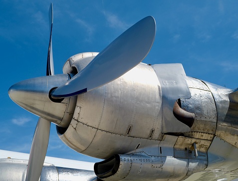 World War II era fighter plane in flight side view