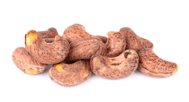 istock Cashew nuts in shell isolated on white background. Roasted and salted cashew nuts. 1411294766