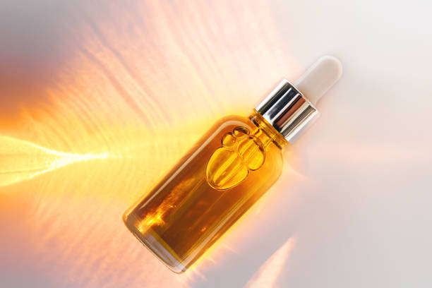 istock Dropper glass Bottle on abstract background 1411294774