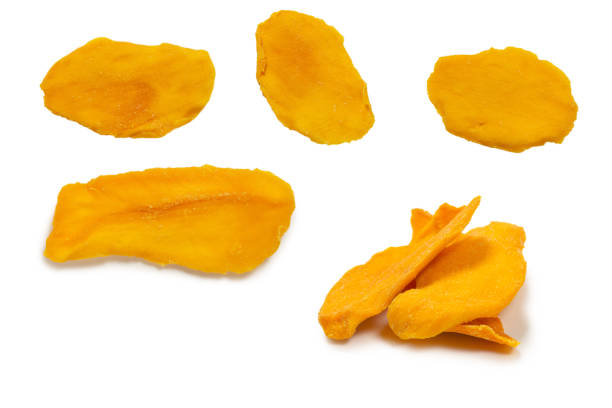 istock Dry tasty mango slices isolated on a white background. 1411295589