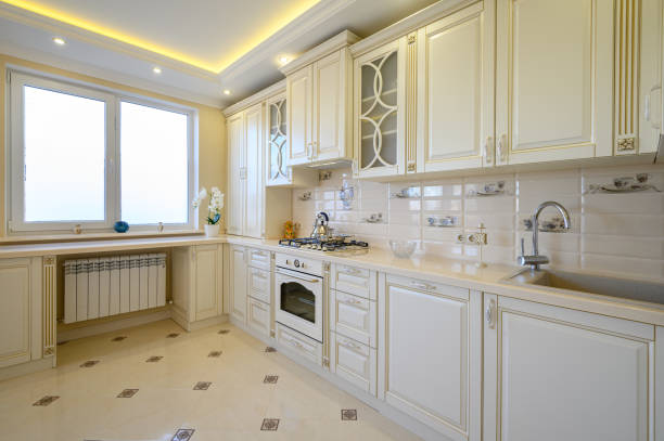 istock Classic white and beige large luxurious kitchen in studio apartment 1411295810