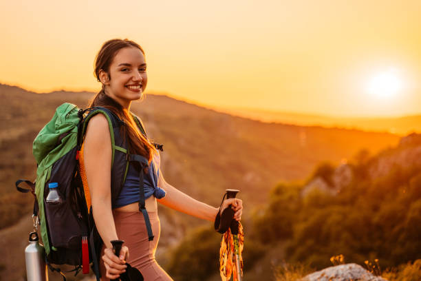 istock Young Woman Hiking On The Mountain 1411295836