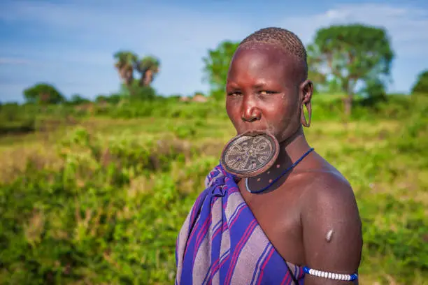 Mursi tribe are probably the last groups in Africa amongst whom it is still the norm for women to wear large pottery or wooden discs or aEplatesaa in their lower lips.