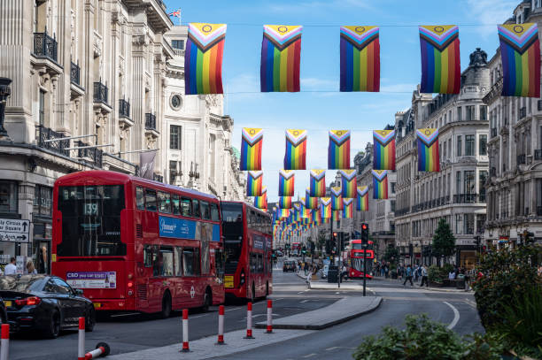 Pride Flags hanging above Regent Street in London London, UK - June 26, 2022 : One hundred intersex-Inclusive Pride flags hang above busy Regent Street in London city of london flag stock pictures, royalty-free photos & images