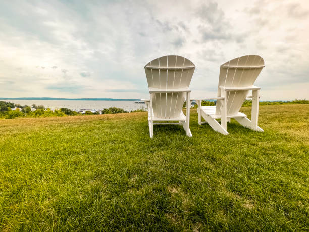 istock High-Back Adirondack Chairs Overlooking the Bay of Water 1411299737