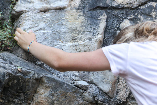 istock A Girl Climbing On The Rock 1411299908