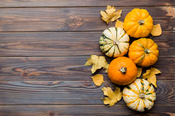 istock Autumn composition. Pattern made of dried leaves and other design accessories on table. Flat lay, top view 1411301813