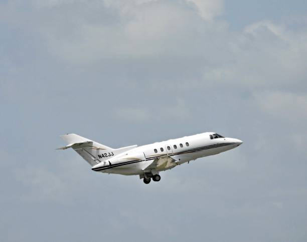 2001 Raytheon Aircraft Co. Hawker 800XP Boca Raton, Palm Beach County, Florida, USA July 27, 2022. A Hawker 800XP,
fixed wing multi engine, 15 seats / 2 engines, N42JJ, taking off from the Boca Raton Airport. 2001 stock pictures, royalty-free photos & images