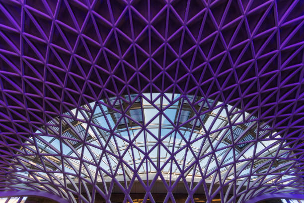 London, UK- April 25, 2016: King's Cross Railway Station is a major railway station to the north direction in London. Here are passengers in the waiting hall of the station.