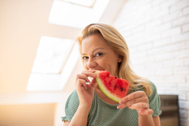 istock Woman eating a healthy breakfast 1411310716