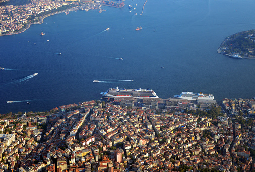 Istanbul, Turkey / Türkiye: Istanbul from the air - Bosporus Strait and two continents - view from Beyoglu in Europe (bottom) towards Üsküdar and Kadiköy in Asia (top left) - Sultanahmet and the entrance to the Golden Horn on the right - Europe and Asia (Anatolia). In the center the Galata cruise terminal, Karaköy neighbourhood of Beyoglu.