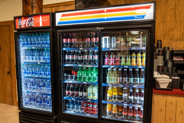 Cooler refrigerator full of pop, soda, and bottled water at the Many Glacier Hotel in Glacier National Park stock photo