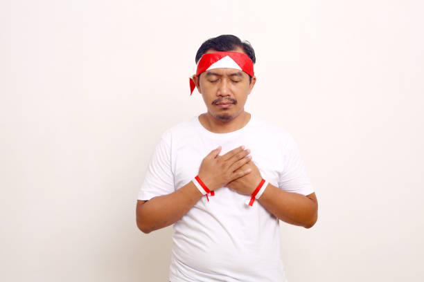 istock Asian man with independence day concept feeling relieved. Isolated on white background 1411318896