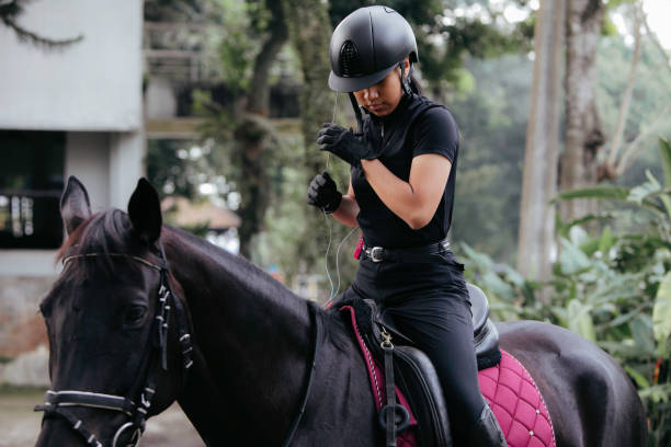 istock young girl Getting Ready to Go Horse Riding 1411321809