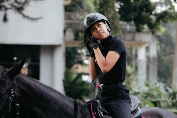 istock young girl Getting Ready to Go Horse Riding 1411321812