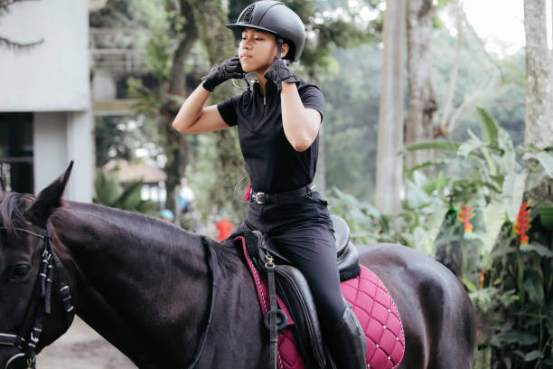 istock young girl Getting Ready to Go Horse Riding 1411321821