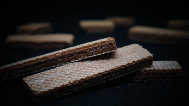 istock Sweet wafers on black background 1411323006