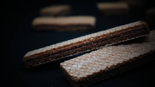 istock Sweet wafers on black background 1411323039
