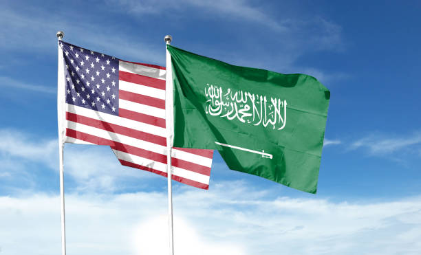 istock Twin Flags USA and Saudi Arabia Waving Flags with Textured Background 1411331702