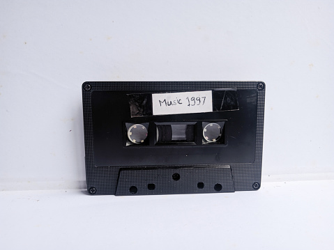 Vintage audio cassette tape isolated on white.