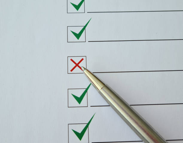istock Check checklist of red and green marks with a pen 1411336871
