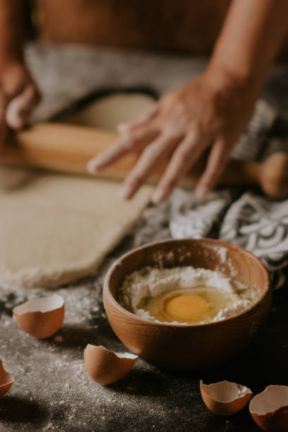 istock rolling a dough of cake ingredients 1411337005