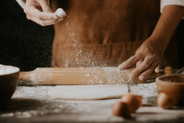 istock rolling a dough of cake ingredients 1411337038