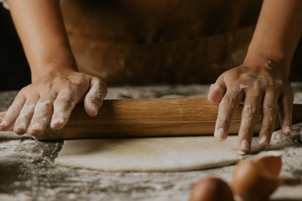 istock rolling a dough of cake ingredients 1411337068